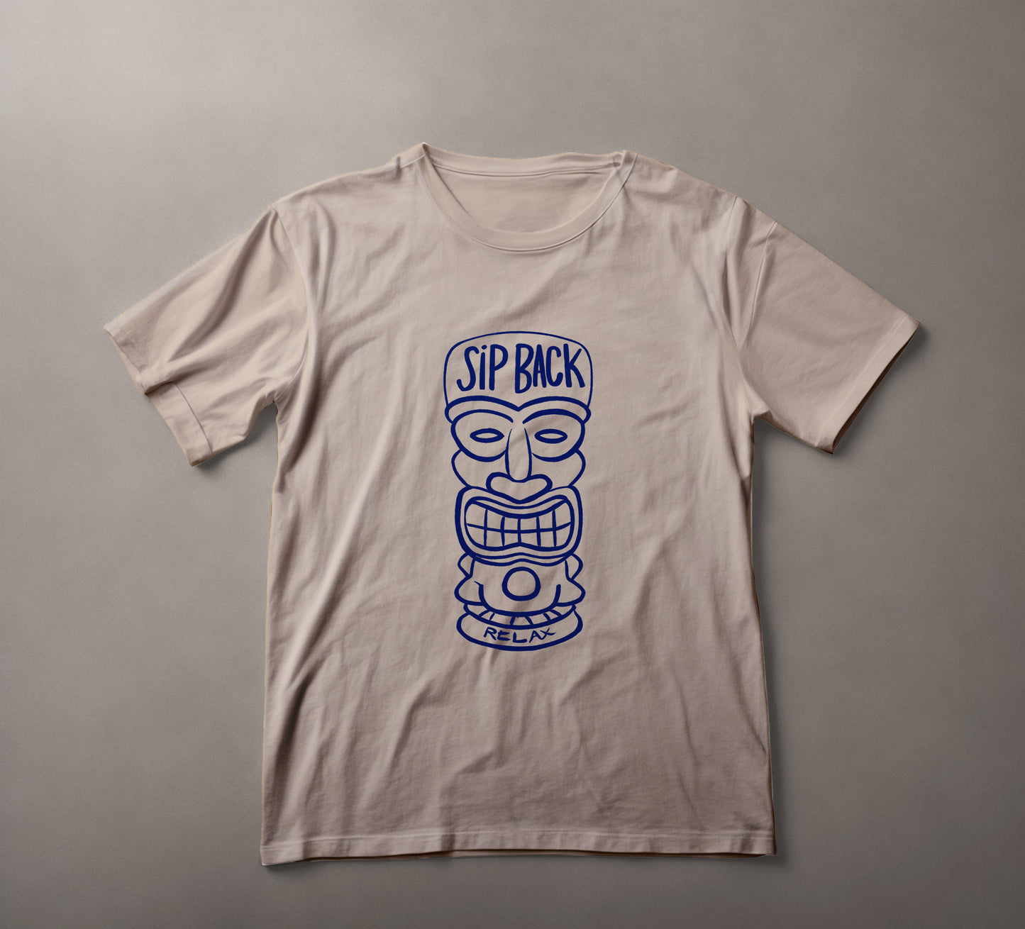 tiki mask t-shirt, relaxed fit tee, beachwear, casual style shirt, tropical themed apparel, vacation clothing, leisurewear, sip back relax, navy blue graphic tee, summer fashion