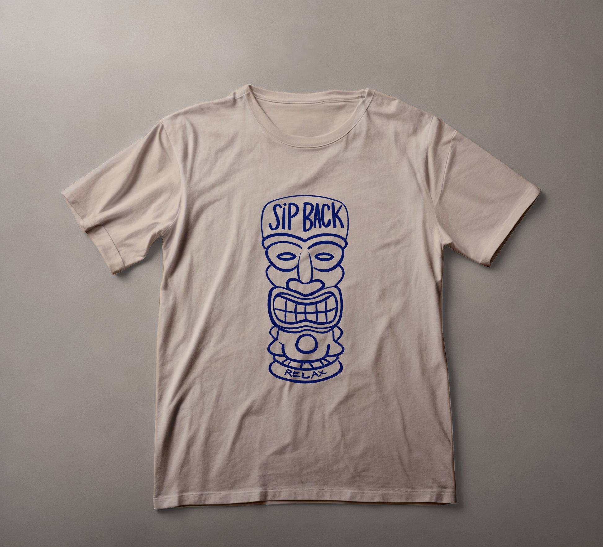 tiki mask t-shirt, relaxed fit tee, beachwear, casual style shirt, tropical themed apparel, vacation clothing, leisurewear, sip back relax, navy blue graphic tee, summer fashion