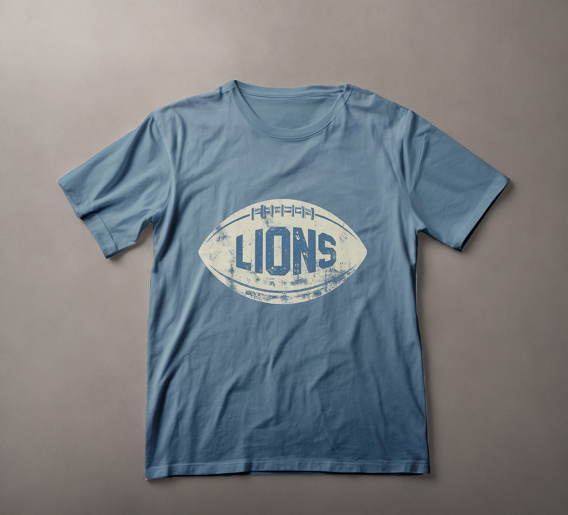 Vintage Football T-Shirt, Retro Lions Tee, Distressed Sports Apparel, Classic Gridiron Shirt, Old-School Football Gear, Team Spirit Clothing, Casual Athletic Wear, Sports Legacy Fashion, Faded Rugby Ball Design, Football Fan Merchandise, Heritage Sports Tee