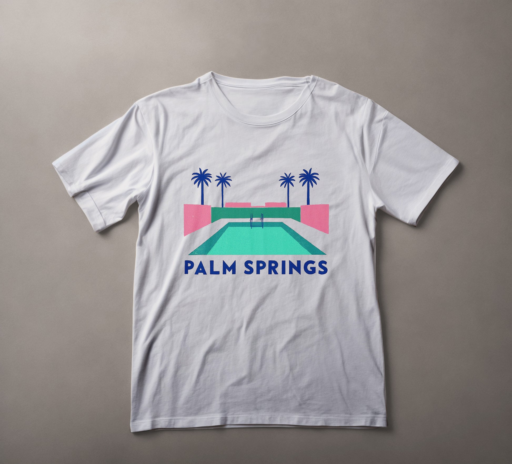 Palm Springs t-shirt, retro pool design, summer vibes clothing, palm tree graphic, resort wear, vacation tee, minimalist design shirt, pastel color top, leisure fashion, desert oasis apparel