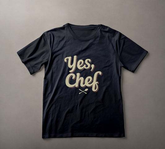 Vintage, graphic tee, culinary phrase, chef apparel, kitchen utensils, retro script, dark fabric, t-shirt design, casual wear, cooking-themed, stylish text, yes chef, the bear